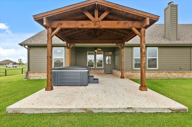 View of patio / terrace with a hot tub, ceiling fan, and a gazebo | Image 25