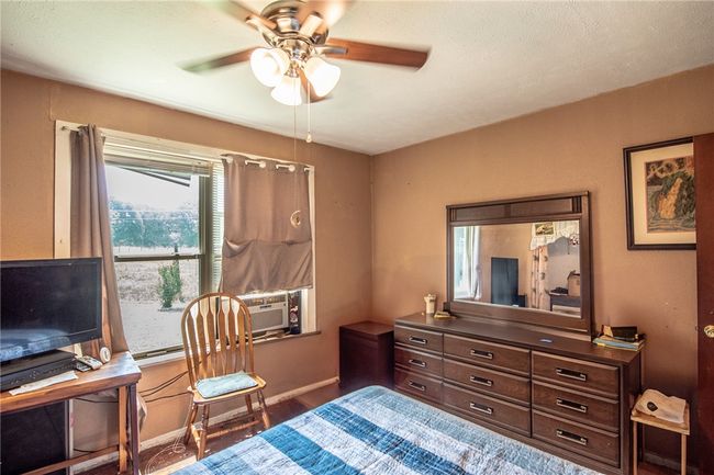 Bedroom featuring a ceiling fan | Image 20