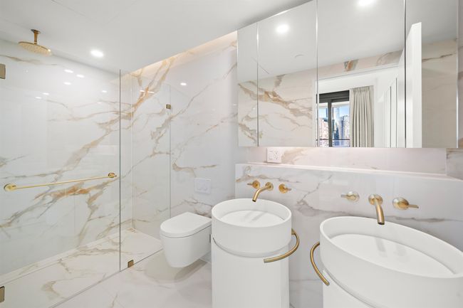 Bathroom featuring recessed lighting, a marble finish shower, toilet, and marble finish floor | Image 11