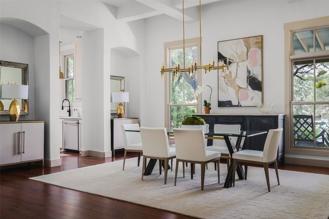 Dining room featuring coffered ceiling- large windows to front and open to great room. Great flow for entertaining. | Image 4