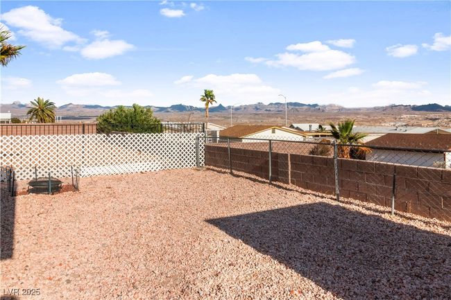 View of yard with a fenced backyard and a mountain view | Image 42