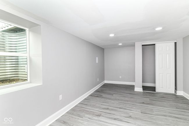 below grade area with recessed lighting, baseboards, and wood finished floors | Image 29