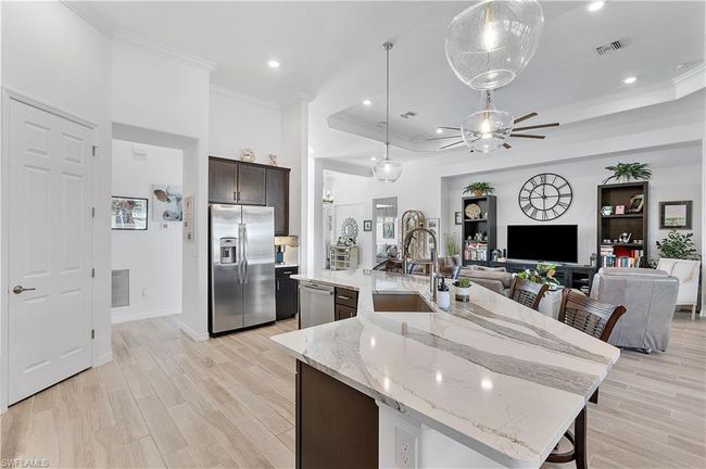 Kitchen featuring a spacious island and appliances with stainless steel finishes | Image 36