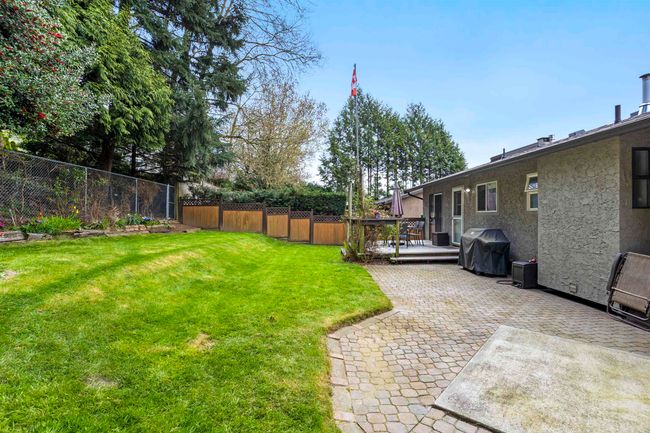 View of yard with a patio, a fenced backyard, and a wooden deck | Image 28