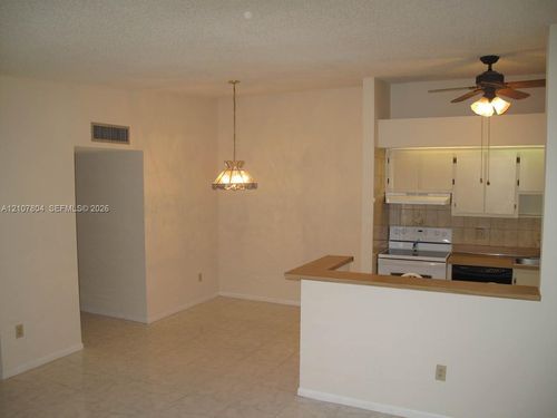 203-9940 S Belfort Cir, Tamarac, FL, 33321-1867 | Card Image