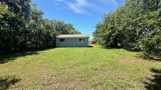 Open and treed lot adds privacy and versatility | Image 32