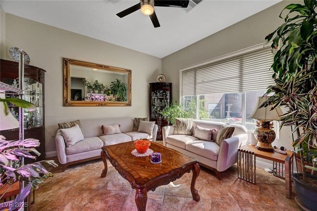 Living area featuring a ceiling fan and vaulted ceiling | Image 30