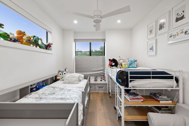 Bedroom with light wood-type flooring, recessed lighting, and ceiling fan | Image 23