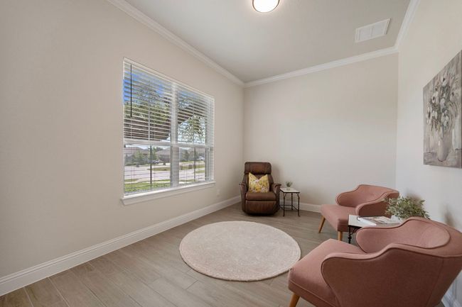 Sitting room featuring ornamental molding, wood finished floors, and baseboards | Image 20