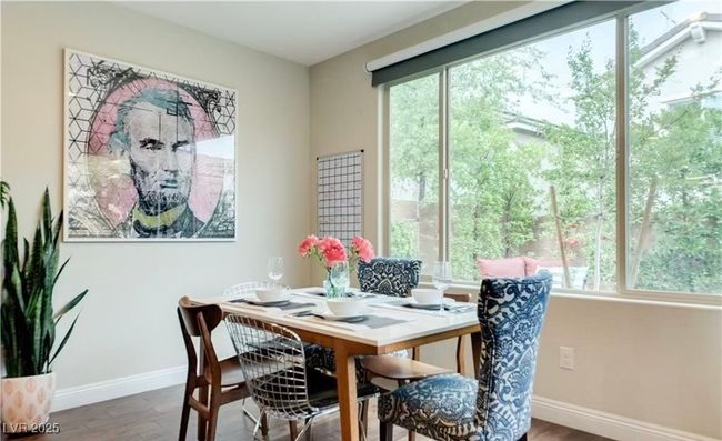 Dining room featuring baseboards and wood finished floors | Image 4