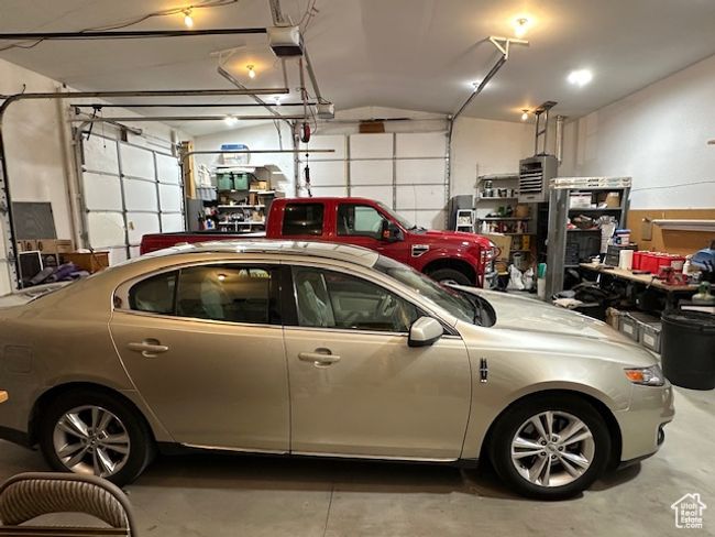Garage with a garage door opener | Image 17