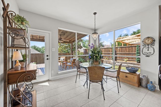 Breakfast room takes advantage of large windows and views of outside and provides amble space for larger dining table. | Image 16