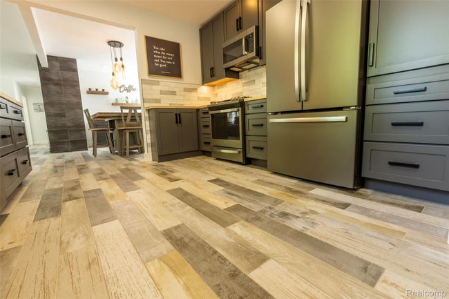 Porcelain "wood-look" tile throughout the home - beautiful! | Image 12