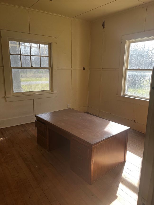 Unfurnished dining area featuring a healthy amount of sunlight and wood-type flooring | Image 6
