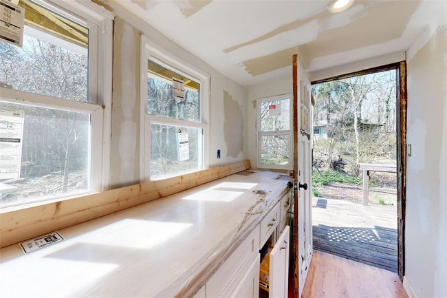 View of unfurnished sunroom | Image 17