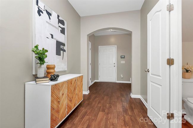 View to foyer area showing garage door to the left and powder room door to the right. | Image 16