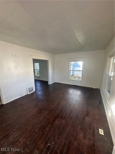 Empty room with dark hardwood / wood-style flooring | Image 2