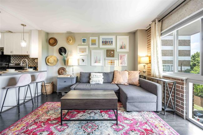 The brick wall wraps around the windows, striking the perfect balance between natural light and dramatic architectural detail. | Image 9