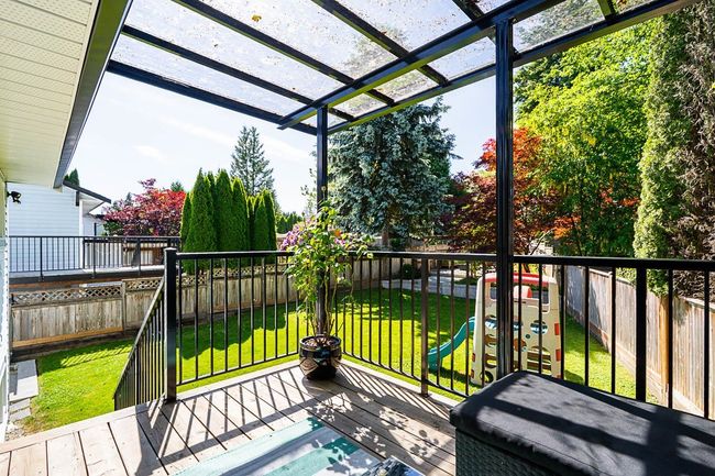 Wooden terrace with a pergola and a playground | Image 20