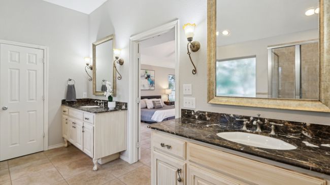 Ensuite bathroom featuring two vanities, ensuite bathroom, a sink, and tile patterned floors | Image 28