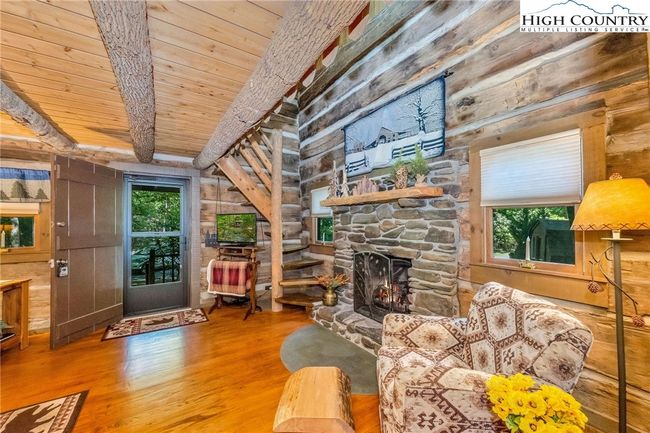 Living room with gas logs. | Image 7