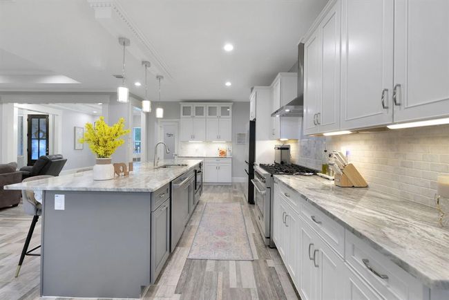 This perspective captures the seamless transition from the kitchen to the elegant butler’s pantry, adding both function and flow to the home’s design. | Image 19