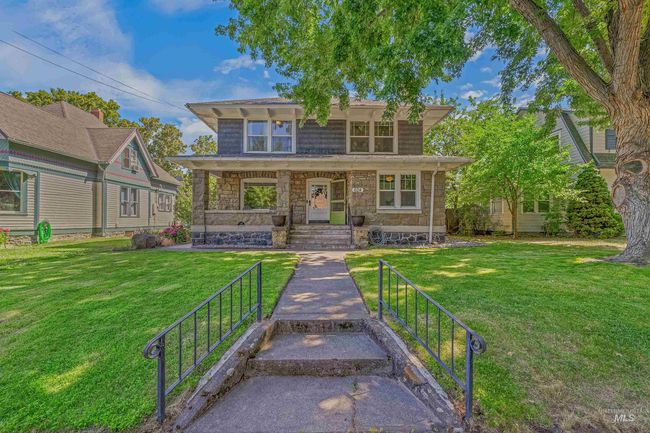 View of front of property with stone siding and a front yard | Image 50