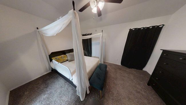 Carpeted bedroom featuring a ceiling fan | Image 30