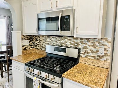 Perfect Kitchen for Merry Meal Prep + Culinary Creativeness!! Granite Counters, Stunning Tile Backsplash, 5 Burner Gas Range with Griddle + Built in Microwave ~ | Image 3