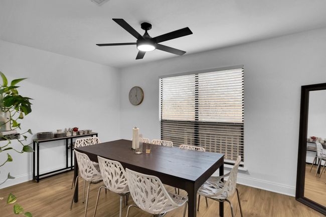 Dining area with a ceiling fan and light wood-type flooring | Image 11
