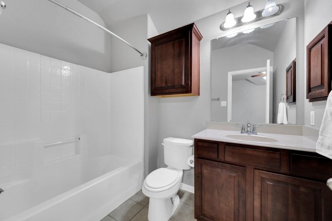Full ensuite bathroom adjoins a bedroom as an upstairs master suite. | Image 27