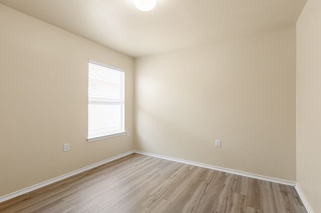 Spare room featuring light wood-style flooring and baseboards | Image 23