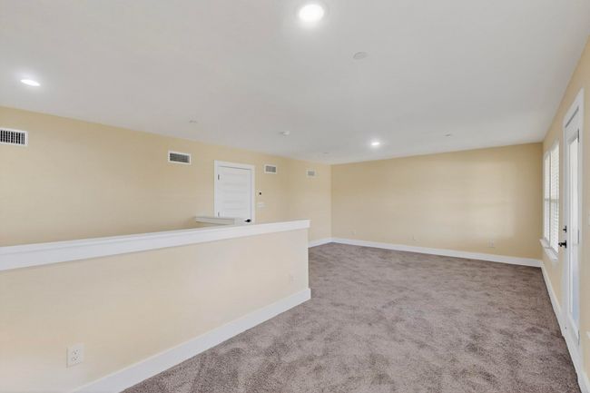 Carpeted empty room with recessed lighting | Image 31