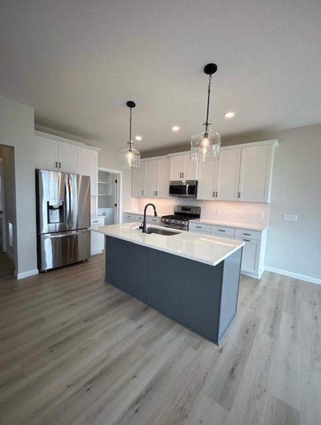 Home is almost complete.... You will love the large pantry with cabinetry your "morning room". Appliances included! | Image 6