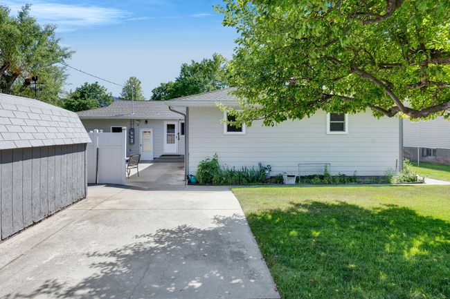Single story home featuring a front lawn and a patio | Image 46