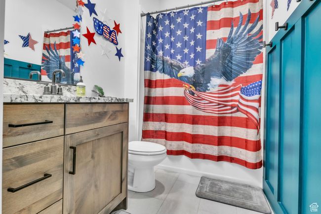 Full bath with vanity and tile patterned flooring | Image 16