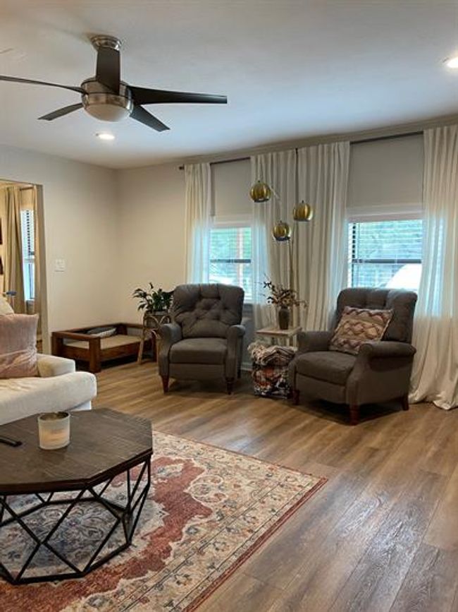 Living room featuring ceiling fan, light wood-type flooring, and recessed lighting | Image 7