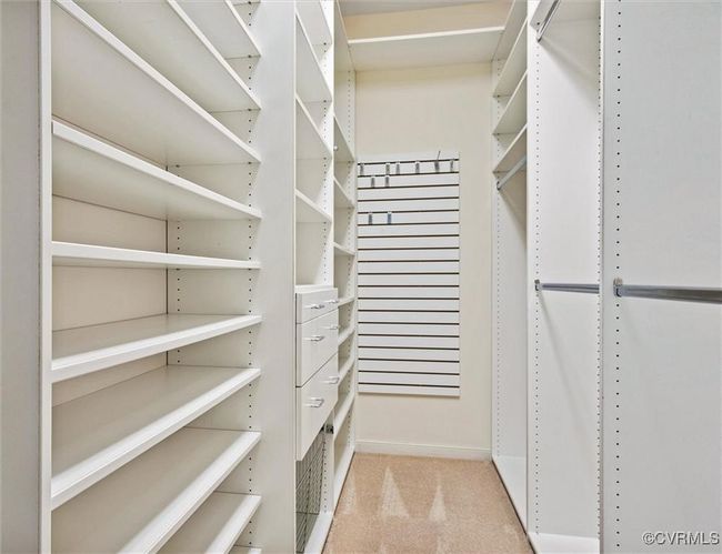 Custom walk-in closet in primary bedroom | Image 16