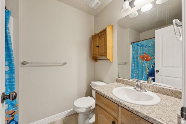 Bathroom featuring vanity, tile patterned flooring, and a shower with shower curtain | Image 22