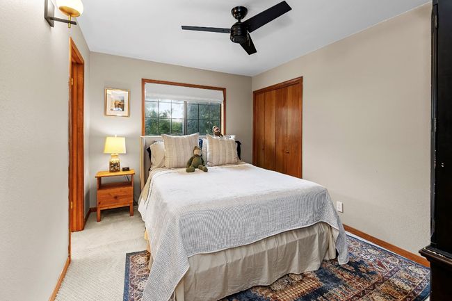Bedroom with ceiling fan and a closet | Image 26