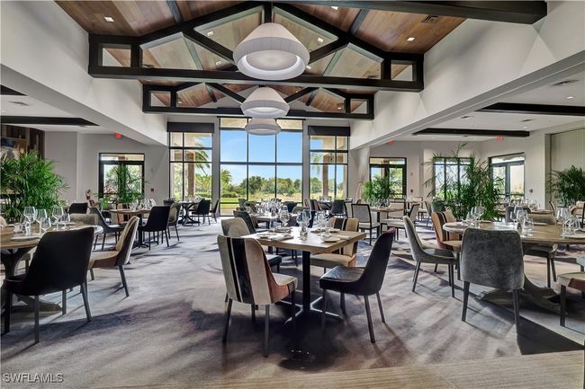Carpeted dining room featuring high vaulted ceiling, beamed ceiling | Image 38