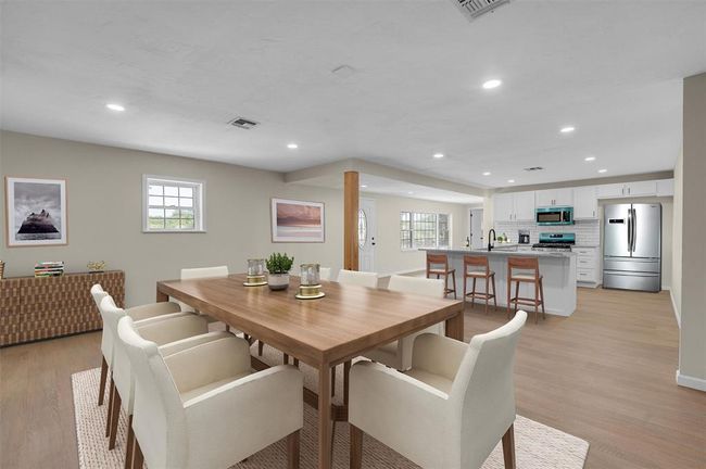 Dining space with light hardwood / wood-style floors and sink | Image 13