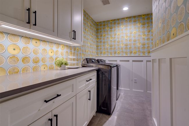 Laundry area with visible vents, washing machine and dryer, recessed lighting, a decorative wall, and cabinet space | Image 17