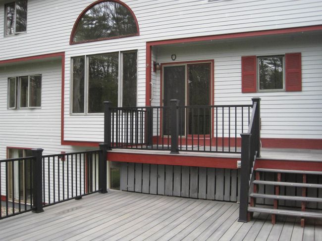 There are stairs leading down on both sides of the deck, to the patio and the family room on the lower level, and the other as easy access to the workshop. Get into the main house either through the screened porch or through a slider by the kitchen. | Image 7