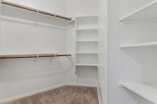Spacious closet featuring carpet flooring | Image 27