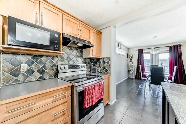 66 Evansbrooke Terr Nw, House other with 5 bedrooms, 4 bathrooms and 4 parking in Calgary AB | Image 5
