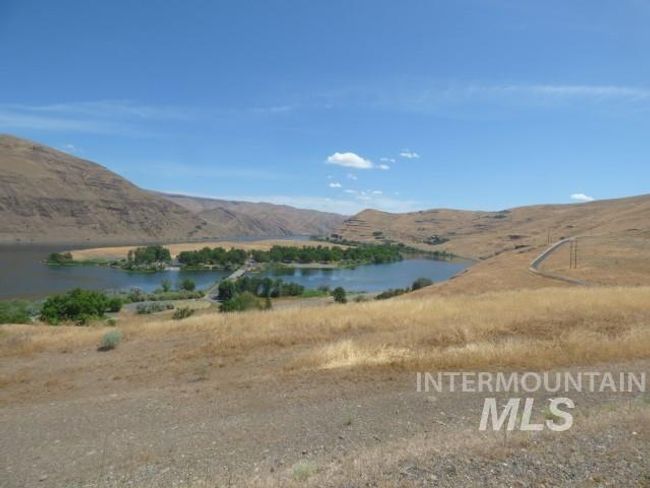View of mountain backdrop featuring a large body of water | Image 20