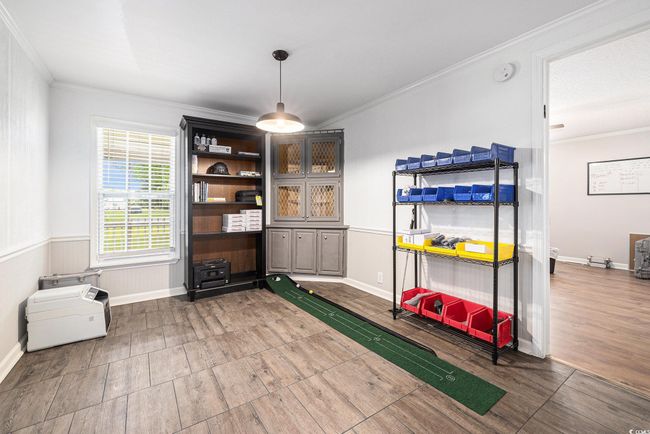 Unfurnished dining area with wood finished floors and ornamental molding | Image 6