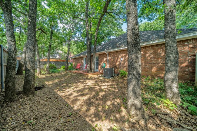 View of side yard. Patio area from primary bedroom | Image 38