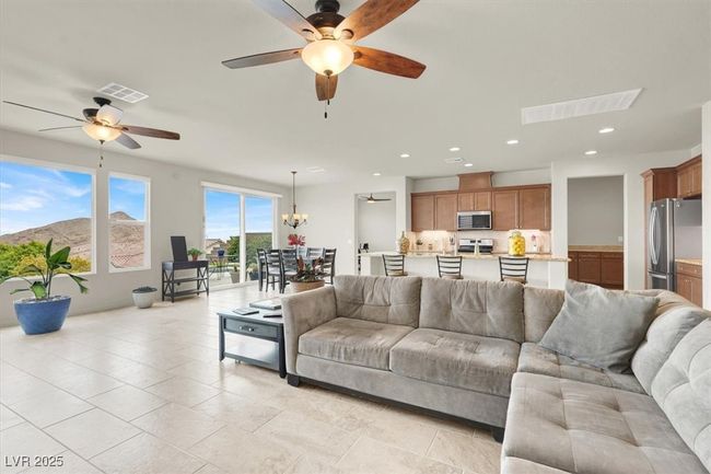 Living area with ceiling fan and recessed lighting | Image 13